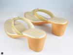 Heel type sandals for ladies in gold with center stone in floral design - 2