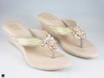 Heel type sandals for ladies in gold with center stone in floral design - 1