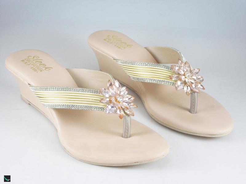 Heel type sandals for ladies in gold with center stone in floral design