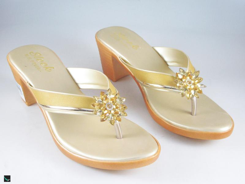 Heel type sandals for ladies in gold with center stone in floral design
